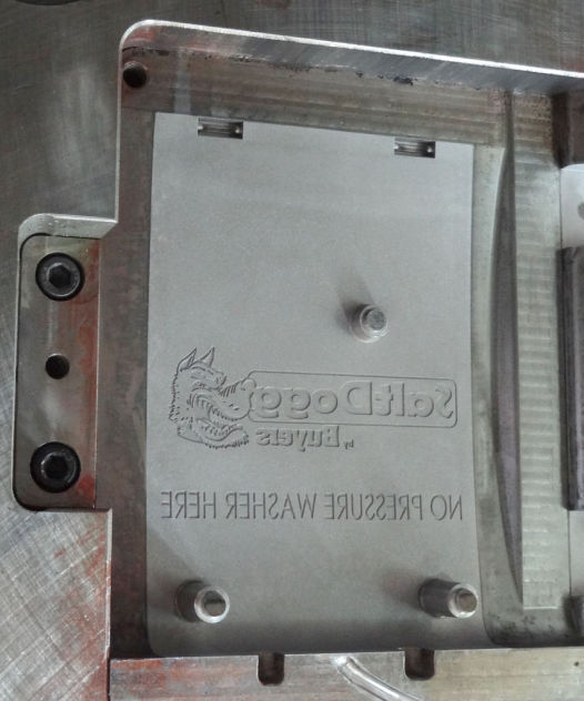 The decorative logo engraving with final surface finish is the last step of the mould maker